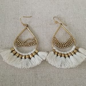 White/gold statement earrings